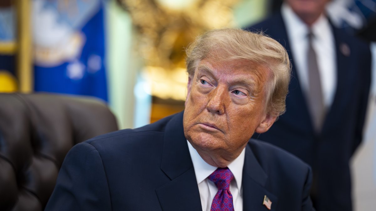 U.S. President Donald Trump listens prior to signing an executive order to rename Lake Ontario as Lake America, amid a recent trade war, in the Oval Office of the White House in Washington, D.C., U.S., Aug. 27, 2026. (EPA Photo)