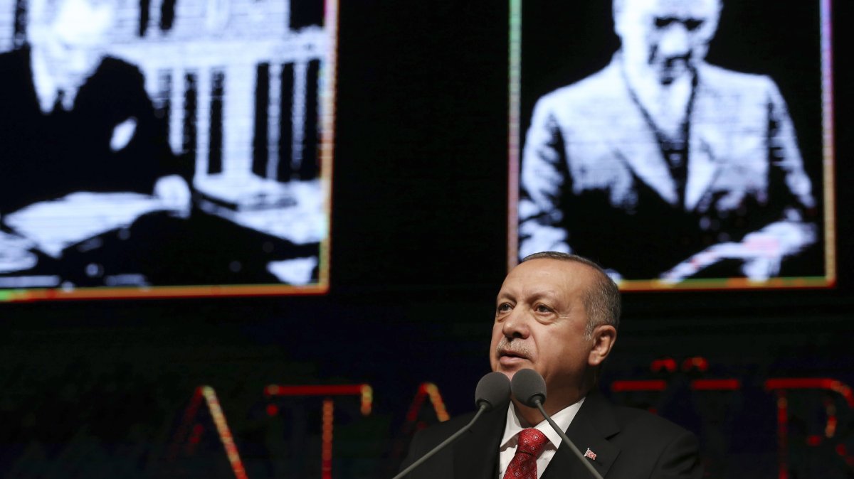 President Recep Tayyip Erdoğan speaks at a ceremony to mark the 80th anniversary of the nation's founding father Mustafa Kemal Atatürk, background, in Ankara, Nov. 10, 2018. (Presidential Press Service via AP)