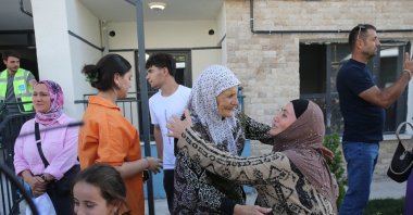 Ahıska Turks share their happiness as they move into permanent homes built for them, Ahlat, Bitlis, Türkiye, Aug. 22, 2026. (AA Photo)