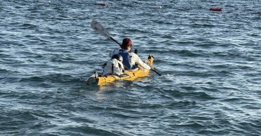 Halil Uzel paddles along the coast during his journey to cover country’s entire coastline, Muğla, Türkiye, Aug. 27, 2026. (DHA Photo) 