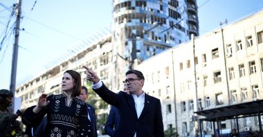 British Prime Minister Andy Burnham reacts as he is shown the rubble and wreckage left on the buildings and site of a strike near the Lukanivska market, Kyiv, Ukraine, Aug. 24, 2026. (Reuters Photo)