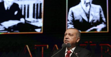President Recep Tayyip Erdoğan speaks at a ceremony to mark the 80th anniversary of the nation's founding father Mustafa Kemal Atatürk, background, in Ankara, Nov. 10, 2018. (Presidential Press Service via AP)
