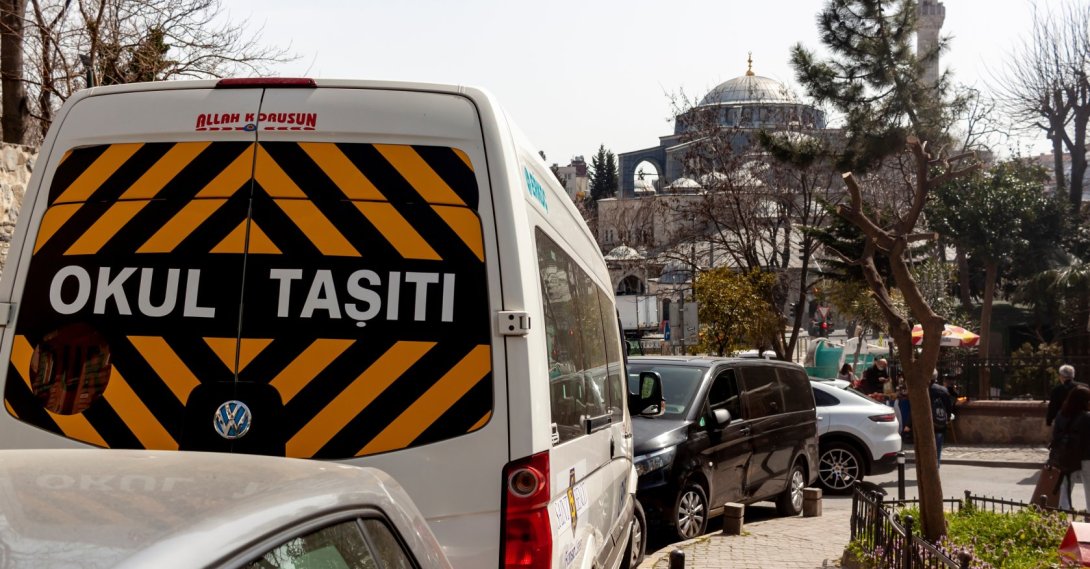A white school bus with a “School Bus” sign, Istanbul, Türkiye, March 24, 2022. (Shutterstcok Photo) 