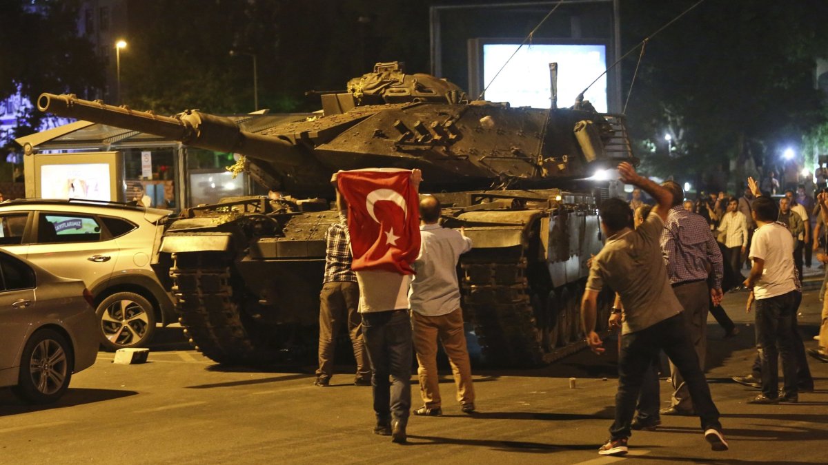 People attempt to stop tanks during the failed coup attempt by Gülenist Terror Group (FETÖ), Ankara, Türkiye, July 16, 2016. (AP Photo) 