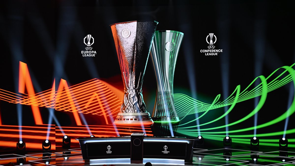 The UEFA Europa League and UEFA Conference League trophies are displayed on stage ahead of the draws for the two competitions at the Grimaldi Forum, Monaco, Aug. 28, 2026. (AA Photo)