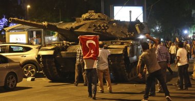 People attempt to stop tanks during the failed coup attempt by Gülenist Terror Group (FETÖ), Ankara, Türkiye, July 16, 2016. (AP Photo) 