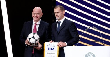 UEFA president Aleksander Ceferin (R) and FIFA president Gianni Infantino pose for a photograph during the 50th Ordinary UEFA Congress at Brussels Expo, Brussels, Belgium, Feb. 12, 2026. (Reuters Photo)