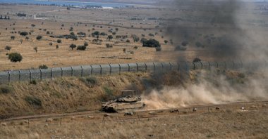 An Israeli tank drives along the cease-fire line between the Israeli-occupied Golan Heights and Syria, Aug. 20, 2026. (Reuters File Photo)
