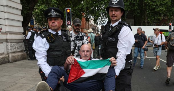 Supporters of the banned Palestine Action group take part in a “Graduation Day” protest organized by Defend Our Juries outside Westminster Magistrates’ Court in solidarity with people facing legal action for supporting the group, London, U.K., July 30, 2026. (AA Photo)