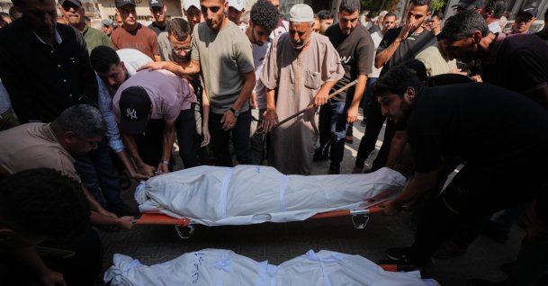 Palestinians mourn over the bodies of their relatives killed in an Israeli army strike during their funeral at Shifa Hospital, Gaza City, Palestine, Aug. 26, 2026. (AP Photo)