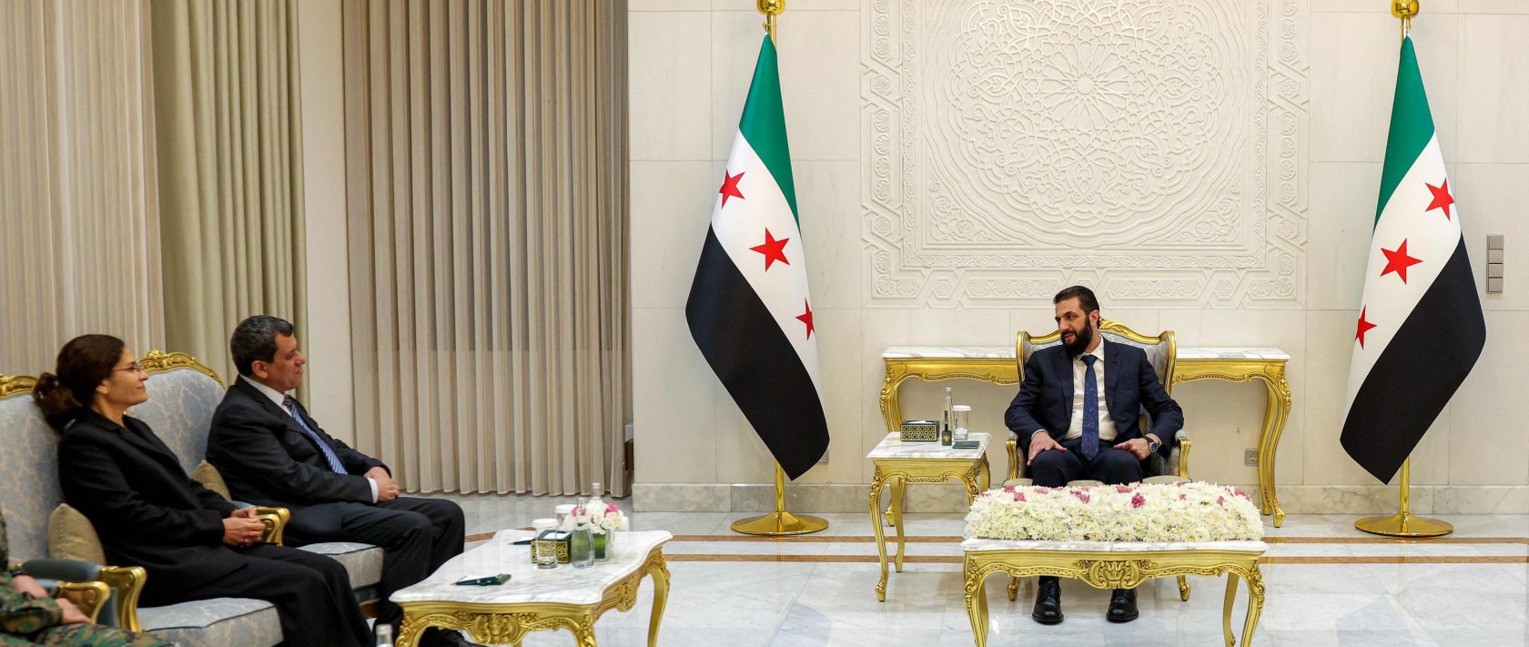 Syria's President Ahmed al-Sharaa meets with SDF ringleader Mazloum Abdi, at the People's Palace in Damascus. (AFP Photo)
