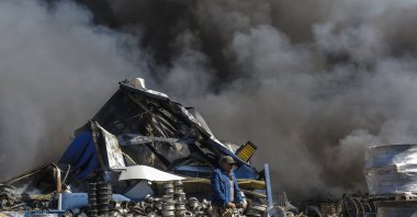A man rides a scooter at the site of a Russian strike on a goods storage facility amid the Russian invasion, Kyiv, Ukraine, Aug. 29, 2026. (EPA Photo)