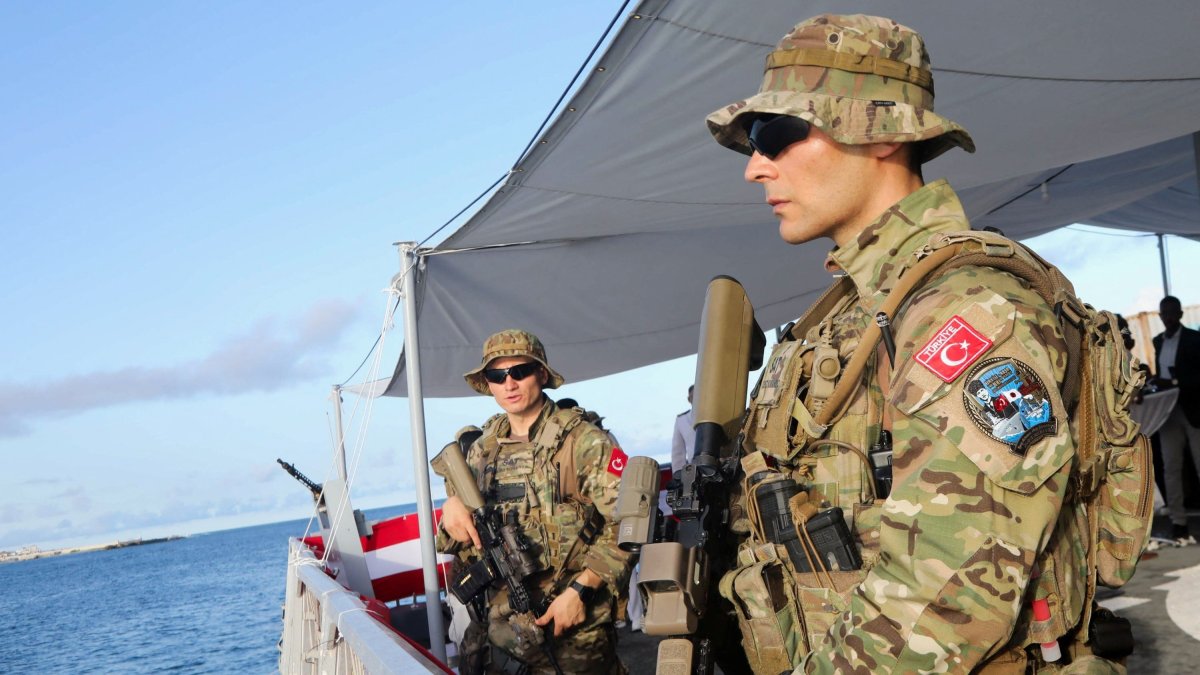 Turkish marine forces stand guard aboard the Turkish Naval Forces Command Ship F514 after it docked at the Mogadishu Sea Port, Mogadishu, Somalia, April 23, 2024. (Reuters Photo)