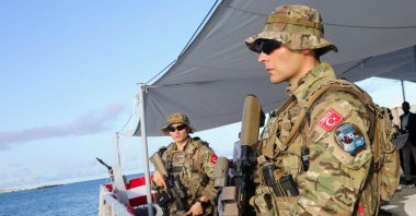 Turkish marine forces stand guard aboard the Turkish Naval Forces Command Ship F514 after it docked at the Mogadishu Sea Port, Mogadishu, Somalia, April 23, 2024. (Reuters Photo)