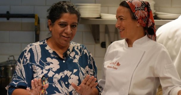 Asma Khan (L) and Sinem Özler (R) prepare dishes together in a kitchen in Istanbul, Türkiye, Aug. 25, 2026. (Photo courtesy of Hasan Mert Kaya)