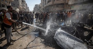 Palestinians inspect a destroyed car following an Israeli air strike on Gaza City, Palestine, Aug. 31, 2026. (EPA Photo)