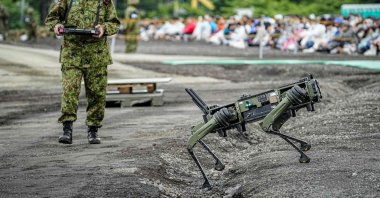 A Japan Ground Self-Defense Force (JGSDF) soldier operates a quadruped unmanned ground vehicle during a live-fire exercise at the East Fuji Maneuver Area, Gotemba, Japan, June 7, 2026. (AFP Photo)