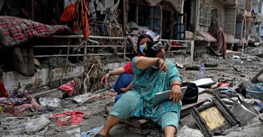 People salvage belongings from their home following flash floods, Devighat, Nuwakot district, Nepal, Aug. 31, 2026. (AFP Photo)