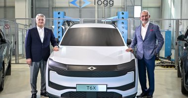 Togg Board Chair Fuat Tosyalı (R) and Togg CEO Gürcan Karakaş pose for a photo beside the prototype of the B-SUV T6X model, Istanbul, Türkiye, Aug. 31, 2026. (AA Photo)