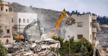 Israeli army excavators demolish Palestinian buildings on the outskirts of Nablus in the Israeli-occupied West Bank, Aug. 31, 2026. (AFP Photo)