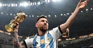 Argentina's captain Lionel Messi poses with the FIFA World Cup Trophy after Argentina won the Qatar 2022 World Cup final football match between Argentina and France at Lusail Stadium in Lusail, north of Doha, Qatar, Dec. 18, 2022. (AFP Photo)