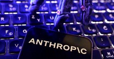 Anthropic logo, a keyboard and a robotic hand in this illustration taken June 5, 2026. (Reuters Photo)