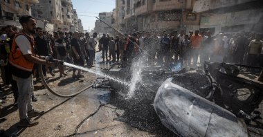 Palestinians inspect a destroyed car following an Israeli air strike on Gaza City, Palestine, Aug. 31, 2026. (EPA Photo)