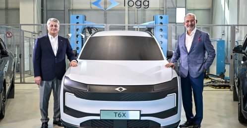 Togg Board Chair Fuat Tosyalı (R) and Togg CEO Gürcan Karakaş pose for a photo beside the prototype of the B-SUV T6X model, Istanbul, Türkiye, Aug. 31, 2026. (AA Photo)