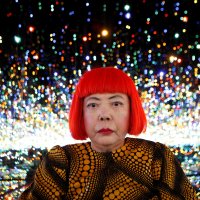 Japanese artist Yayoi Kusama poses for a photograph inside her Infinity Mirrored Room installation titled "The Souls of Millions of Light Years Away" during a media preview of her new exhibition at the David Zwirner gallery, New York, U.S., Nov. 7, 2013. (Reuters Photo)