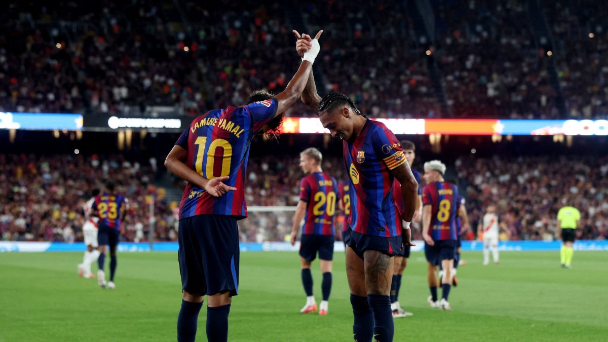 Barcelona's Lamine Yamal (L) celebrates scoring their second goal with Raphinha during the La Liga match against Rayo Vallecano at Spotify Camp Nou, Barcelona, Spain, Aug. 31, 2026. (Reuters Photo)