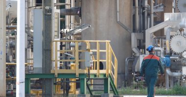 A worker walks at the PCK refinery, a crude oil processing facility supplying gasoline, jet fuel, diesel and fuel oil, Schwedt/Oder, Germany, Aug. 26, 2026. (Reuters Photo)