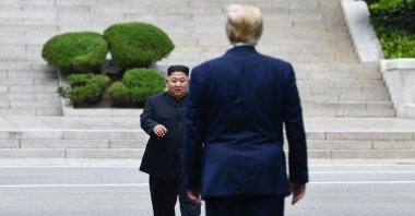 North Korea's leader Kim Jong Un walks to greet U.S. President Donald Trump at the Military Demarcation Line that divides North and South Korea, June 30, 2019. (AFP Photo)