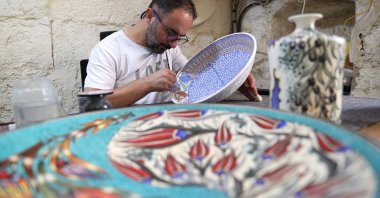 Ceramic artist Zübeyir Ayhan works on a handmade ceramic piece at his workshop, Nevşehir, Türkiye, Sept. 1, 2026. (AA Photo)
