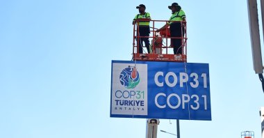 Information and direction signs are being installed on a road in Antalya province, southern Türkiye, Aug. 25, 2026. (IHA Photo)