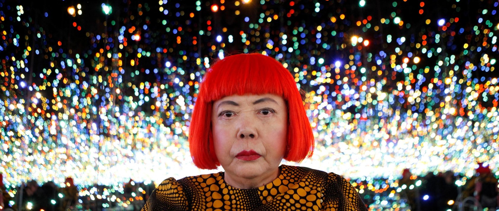 Japanese artist Yayoi Kusama poses for a photograph inside her Infinity Mirrored Room installation titled "The Souls of Millions of Light Years Away" during a media preview of her new exhibition at the David Zwirner gallery, New York, U.S., Nov. 7, 2013. (Reuters Photo)