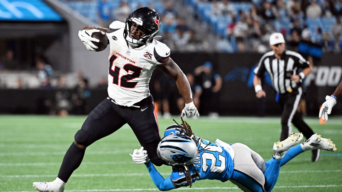 Houston Texans running back Owen Wright (42) runs with the ball against Carolina Panthers cornerback Tyrek Funderburk (20) during the second half at Bank of America Stadium, Charlotte, North Carolina, U.S., Aug 28, 2026. (Reuters Photo via Bob Donnan-Imagn Images)