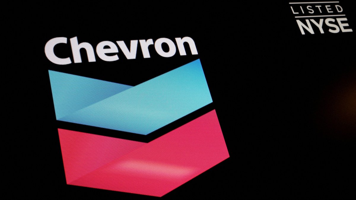 The logo and trading information for Chevron are displayed on a screen on the floor of the New York Stock Exchange (NYSE), New York City, U.S., June 27, 2022. (Reuters Photo)