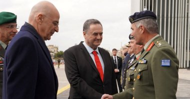 Israel Defense Minister Israel Katz shakes hands with the general director of the General Directorate for Defense Investments and Armaments (GDDIA) of Greece, Maj. Gen. Ioannis Bouras, next to Greece's Defense Minister Nikolaos Dendias, Greece, Jan. 2026. (Reuters Photo)