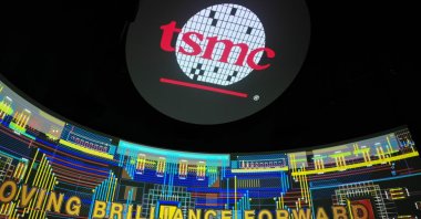 The TSMC logo is seen on screens at the TSMC Renovation Museum at the Hsinchu Science Park in Hsinchu, Taiwan, July 5, 2023. (AFP Photo)
