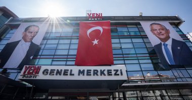 A view of the headquarters of the newly founded New Party (YP), featuring images of Türkiye's founding leader Mustafa Kemal Atatürk (L) and party chairperson Özgür Özel, along with the Turkish flag, Ankara, Türkiye, Aug. 31, 2026. (AA Photo)