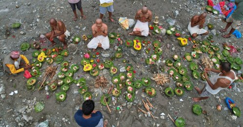 People whose relatives remain missing following flash floods perform rituals after symbolic funeral rites on the banks of the swollen Trishuli River, Nuwakot, Nepal, Sept. 2, 2026. (AP Photo)