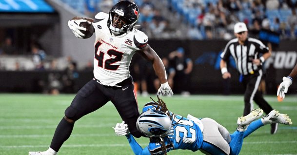 Houston Texans running back Owen Wright (42) runs with the ball against Carolina Panthers cornerback Tyrek Funderburk (20) during the second half at Bank of America Stadium, Charlotte, North Carolina, U.S., Aug 28, 2026. (Reuters Photo via Bob Donnan-Imagn Images)