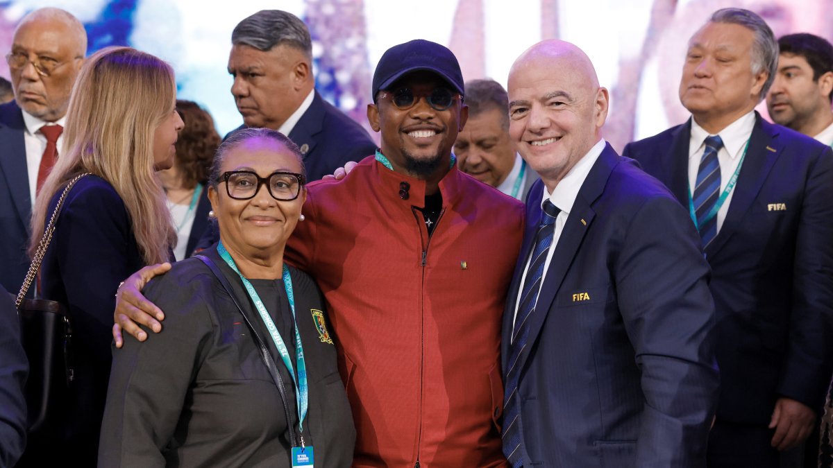 (L-R) Celine Eko, Samuel Eto'o and FIFA President Gianni Infantino pose for a photo during the 75th FIFA Congress at Centro de Convenciones de CONMEBOL, Luque, Paraguay, May 15, 2025. (Getty Images Photo)