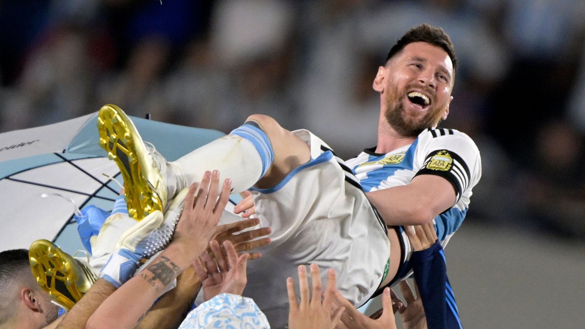 Argentina's forward Lionel Messi is thrown into the air by teammates during a recognition ceremony for the World Cup-winning players, following the friendly football match between Argentina and Panama at the Monumental stadium, Buenos Aires, Argentina, March 23, 2023. (AFP Photo)