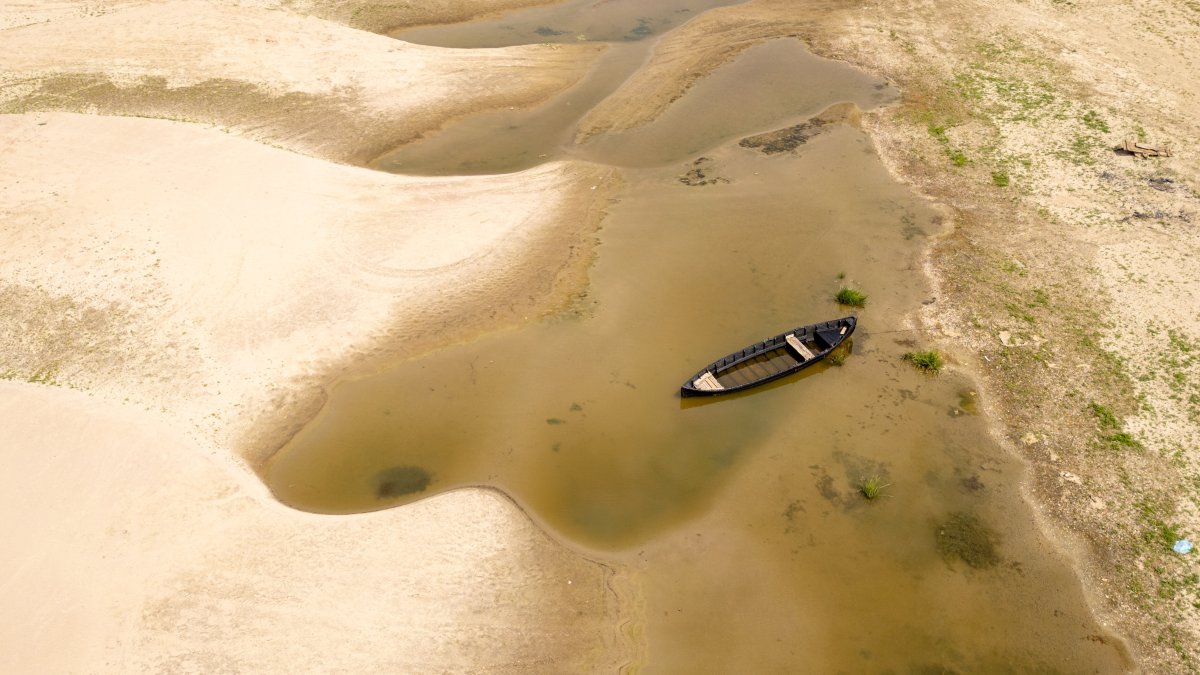 Usually submerged areas of the Danube River are exposed amid exceptionally low water levels, Rasova, Romania, Aug. 3 2026. (AP Photo)