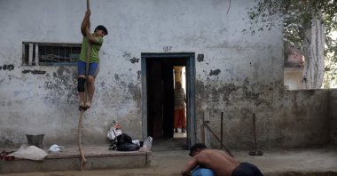 Wrestlers practice at an akhara on the banks of the Yamuna River, New Delhi, India, Dec. 10, 2025. (Reuters Photo)
