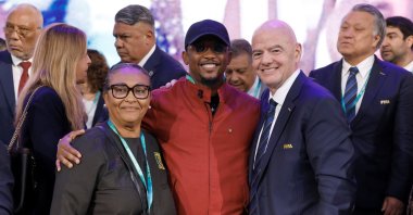 (L-R) Celine Eko, Samuel Eto'o and FIFA President Gianni Infantino pose for a photo during the 75th FIFA Congress at Centro de Convenciones de CONMEBOL, Luque, Paraguay, May 15, 2025. (Getty Images Photo)