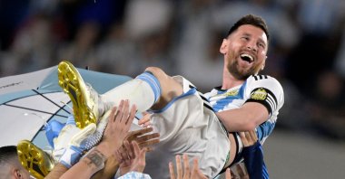 Argentina's forward Lionel Messi is thrown into the air by teammates during a recognition ceremony for the World Cup-winning players, following the friendly football match between Argentina and Panama at the Monumental stadium, Buenos Aires, Argentina, March 23, 2023. (AFP Photo)