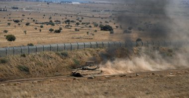 An Israeli tank drives along the cease-fire line between the Israeli-occupied Golan Heights and Syria, Aug. 20, 2026. (Reuters File Photo)