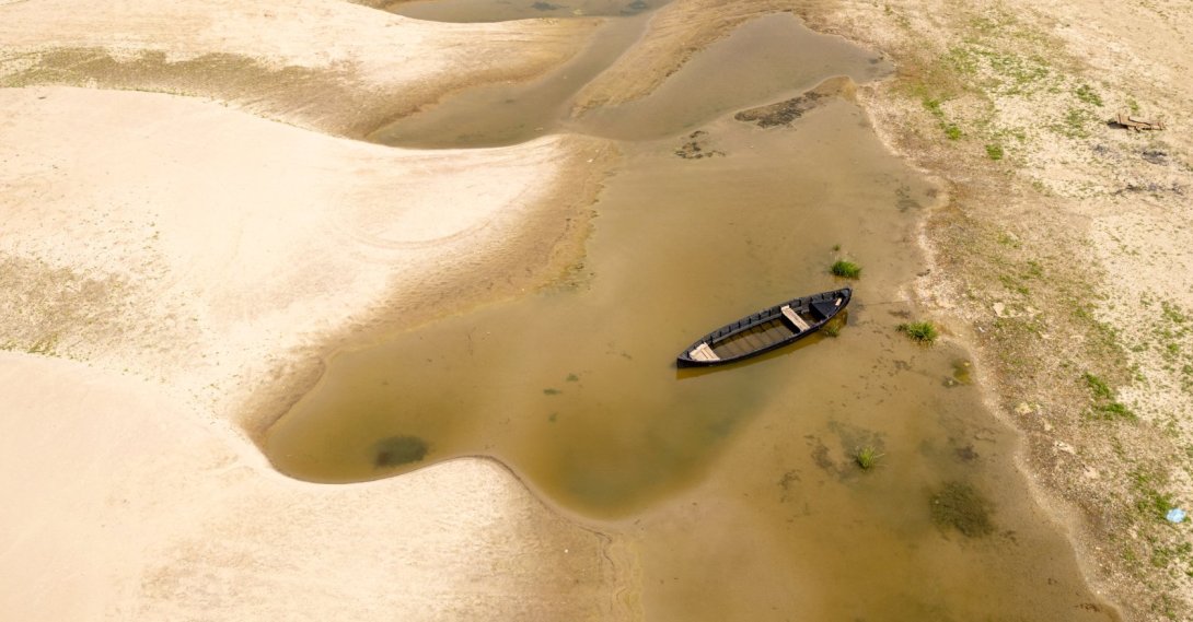Usually submerged areas of the Danube River are exposed amid exceptionally low water levels, Rasova, Romania, Aug. 3 2026. (AP Photo)